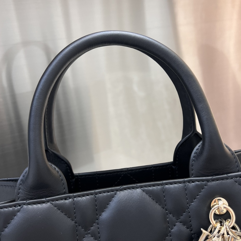 The medium-sized Dior Book Tote in quilted, also known as the "Dior quilted tote bag," is a leather upgrade of the classic Book Tote.