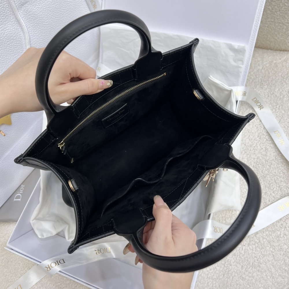 The medium-sized Dior Book Tote in quilted, also known as the "Dior quilted tote bag," is a leather upgrade of the classic Book Tote.