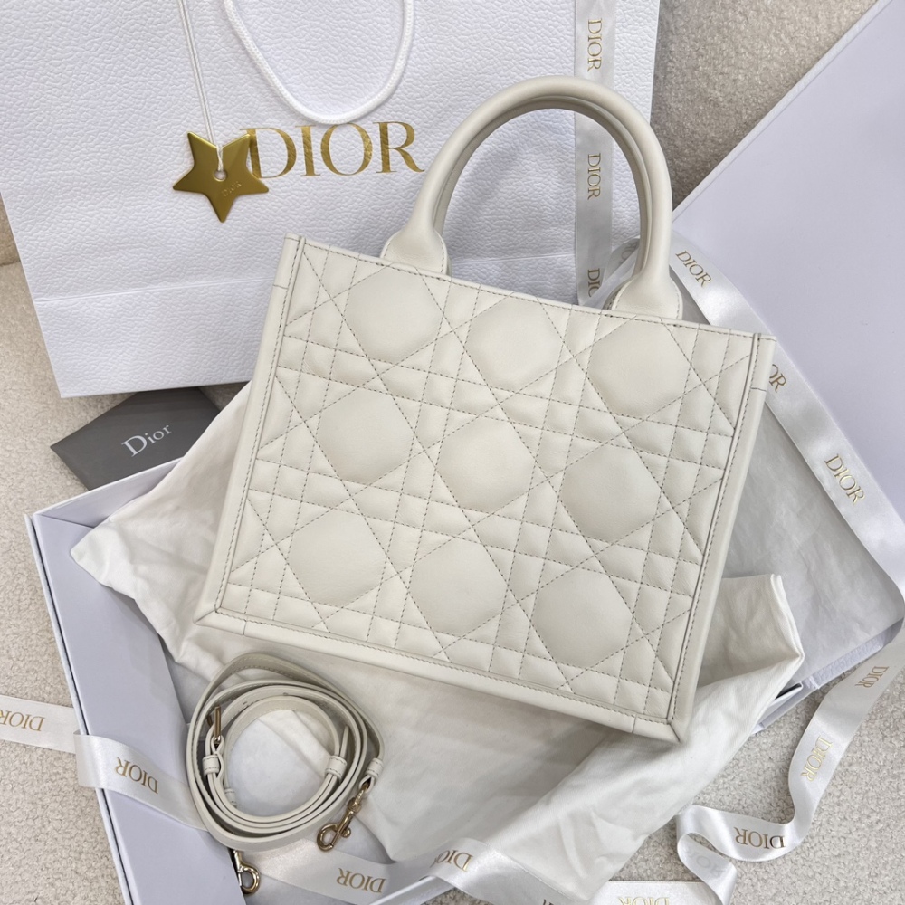 The medium-sized Dior Book Tote in quilted, also known as the "Dior quilted tote bag," is a leather upgrade of the classic Book Tote.