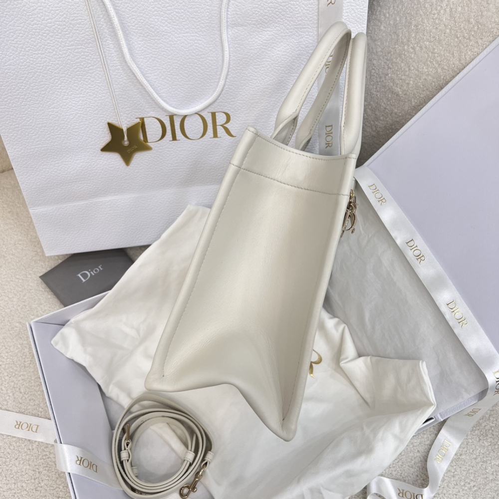 The medium-sized Dior Book Tote in quilted, also known as the "Dior quilted tote bag," is a leather upgrade of the classic Book Tote.