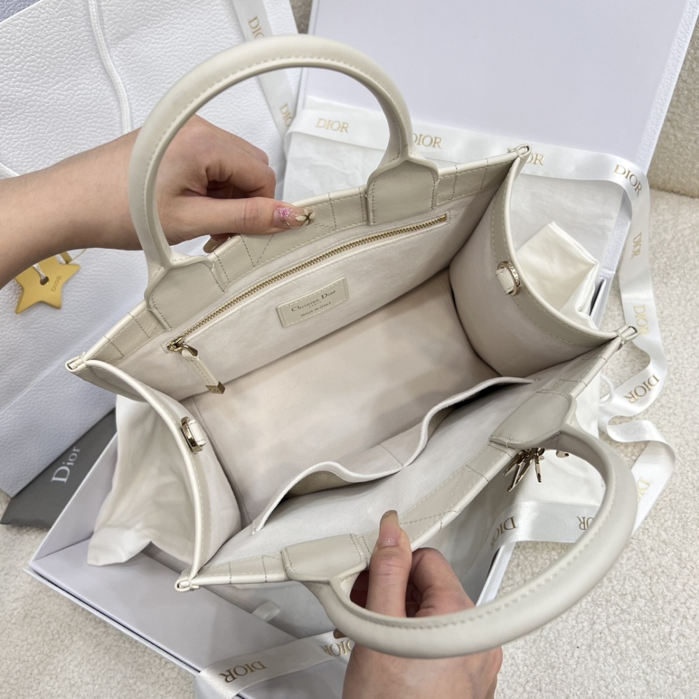 The medium-sized Dior Book Tote in quilted, also known as the "Dior quilted tote bag," is a leather upgrade of the classic Book Tote.