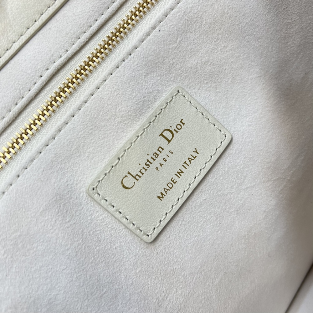 The medium-sized Dior Book Tote in quilted, also known as the "Dior quilted tote bag," is a leather upgrade of the classic Book Tote.