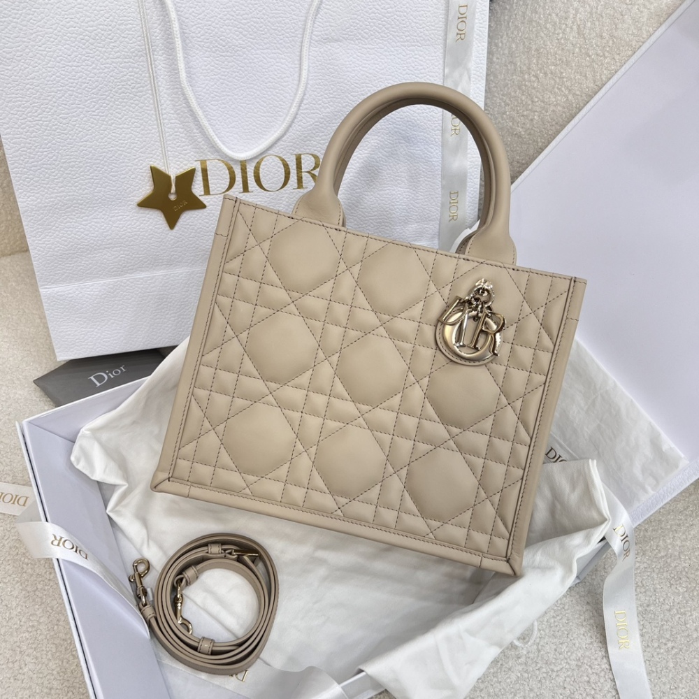 The medium-sized Dior Book Tote in quilted, also known as the "Dior quilted tote bag," is a leather upgrade of the classic Book Tote.