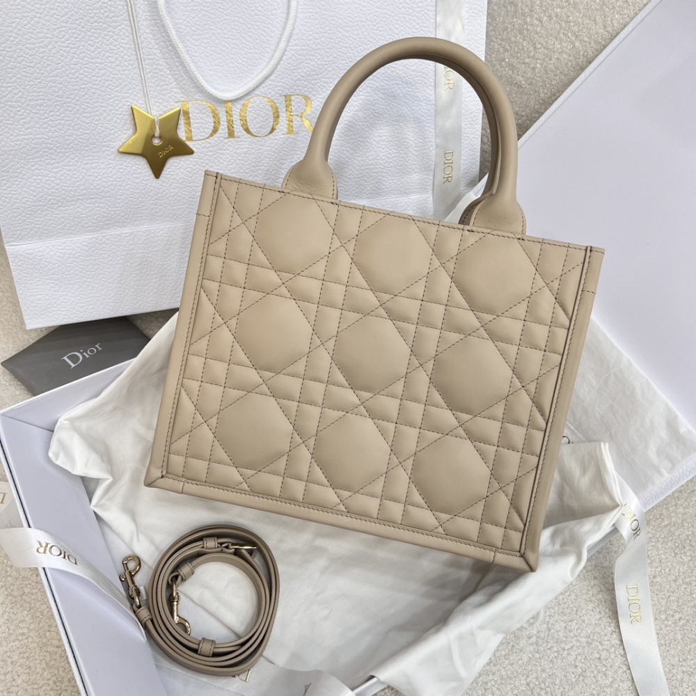 The medium-sized Dior Book Tote in quilted, also known as the "Dior quilted tote bag," is a leather upgrade of the classic Book Tote.