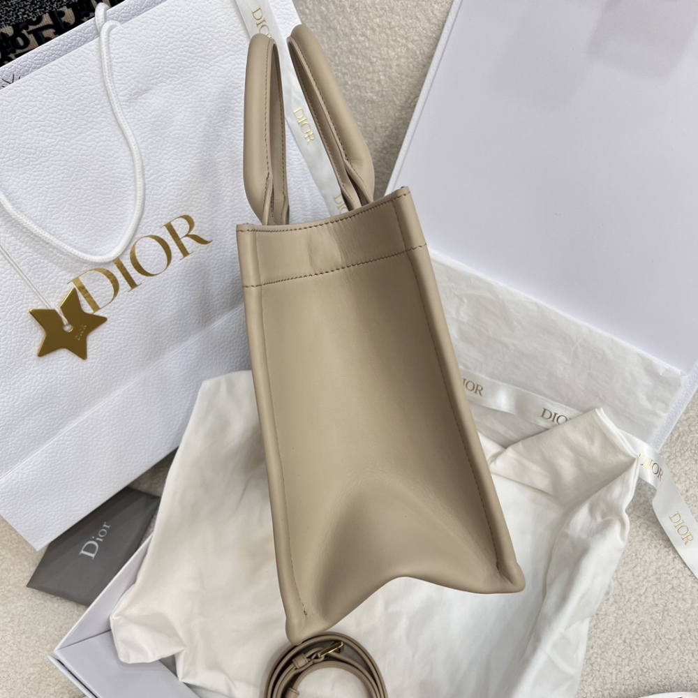 The medium-sized Dior Book Tote in quilted, also known as the "Dior quilted tote bag," is a leather upgrade of the classic Book Tote.