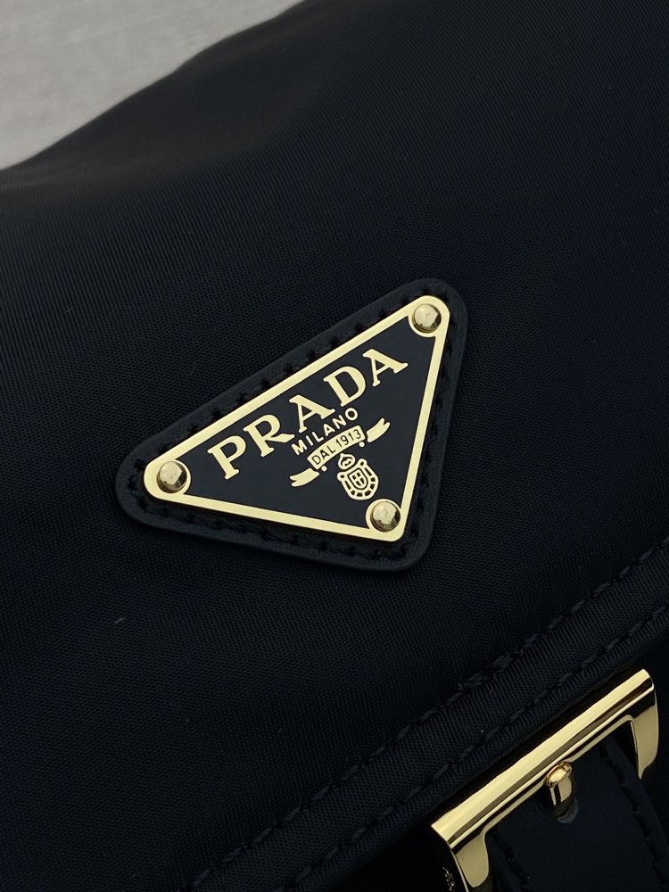 The Prada Re-Nylon flap messenger bag is also a very popular unisex crossbody bag from Prada in recent years.