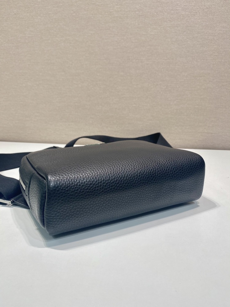 Prada's classic pebbled leather camera bag is the brand's signature unisex crossbody bag.