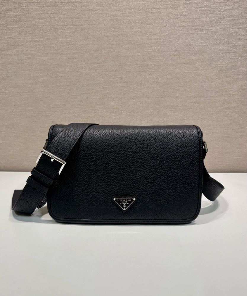 Prada's classic pebbled leather messenger camera bag is the brand's signature unisex crossbody bag.