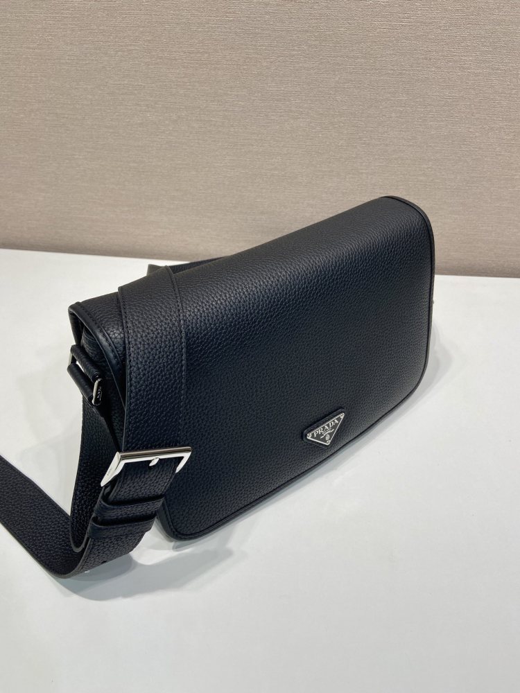 Prada's classic pebbled leather messenger camera bag is the brand's signature unisex crossbody bag.