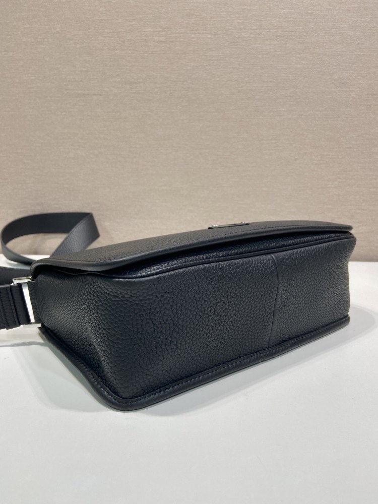 Prada's classic pebbled leather messenger camera bag is the brand's signature unisex crossbody bag.