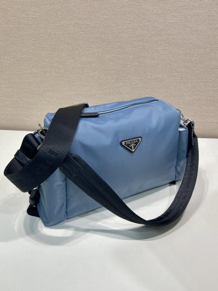 The Prada Re-Nylon double-strap commuter bag is one of the representative styles of Prada's classic utilitarian aesthetic.