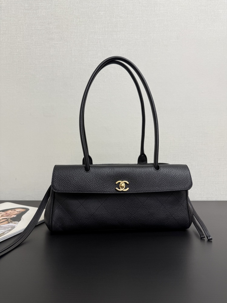 The Chanel caviar leather horizontal long-handled tote bag is a popular commuter style from the Vintage Chanel collection, also known as the "baguette tote".