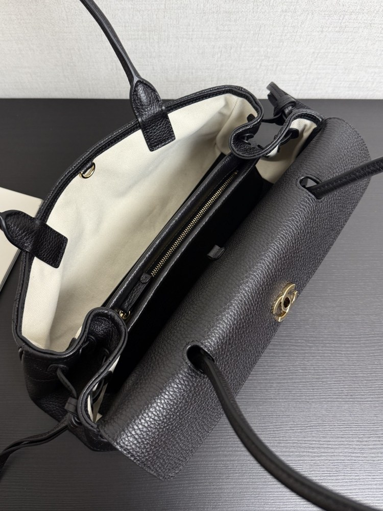 The Chanel caviar leather horizontal long-handled tote bag is a popular commuter style from the Vintage Chanel collection, also known as the "baguette tote".