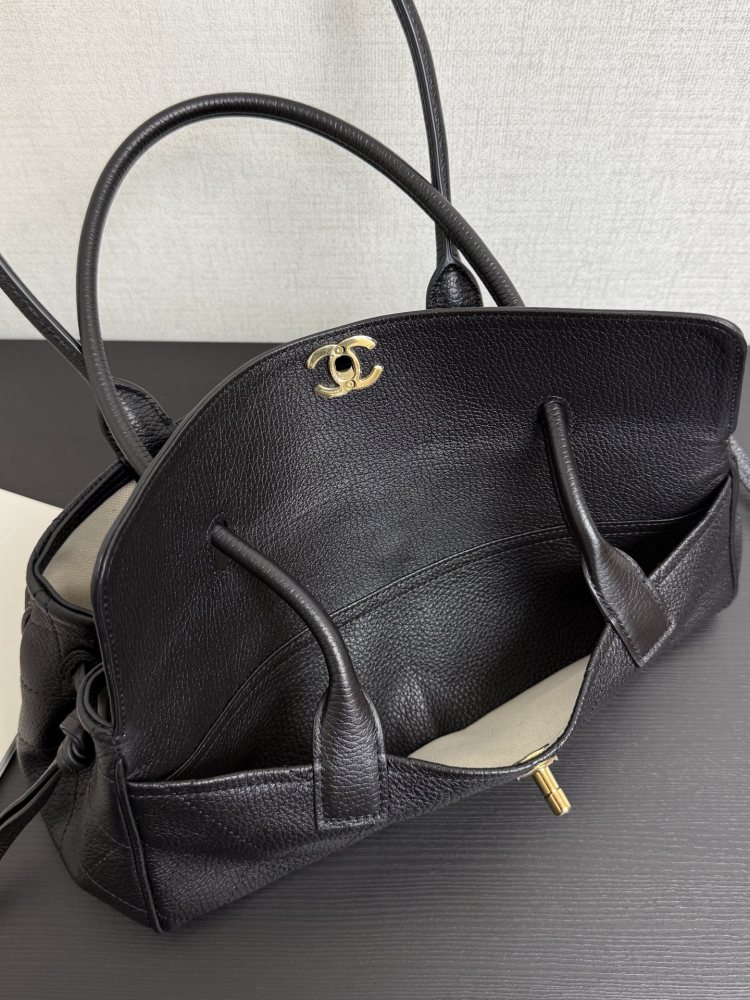 The Chanel caviar leather horizontal long-handled tote bag is a popular commuter style from the Vintage Chanel collection, also known as the "baguette tote".