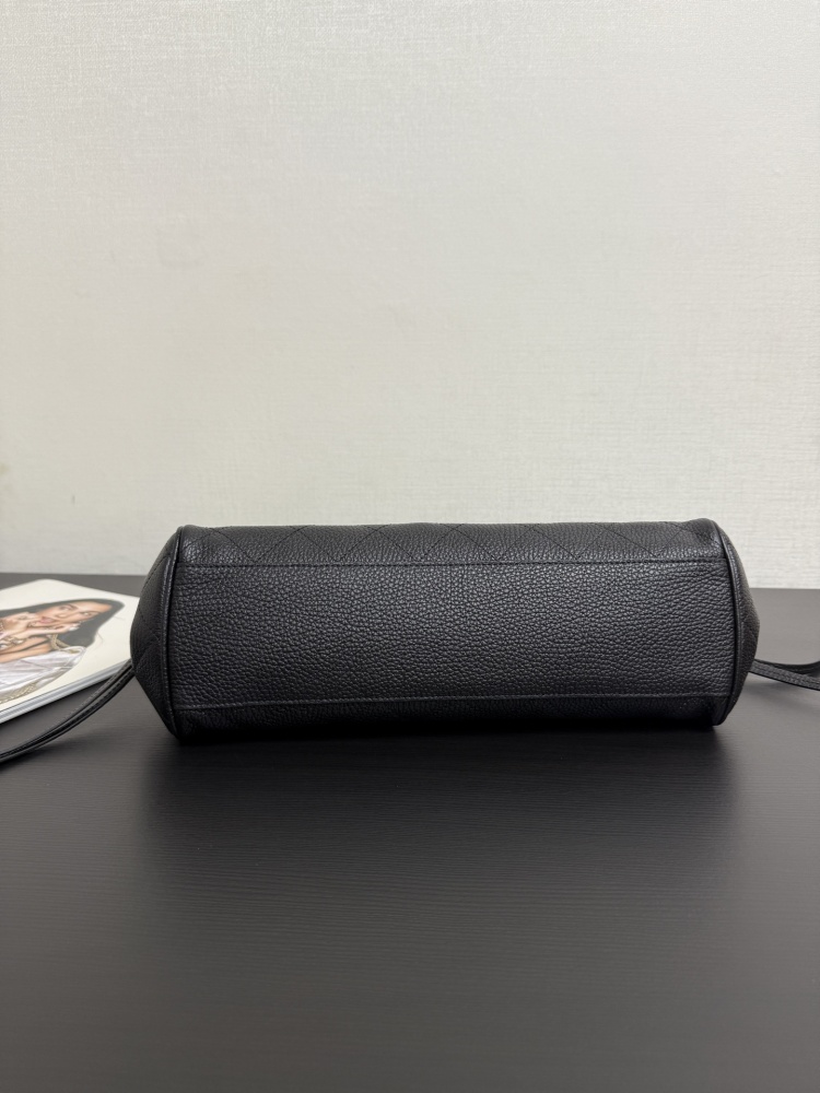 The Chanel caviar leather horizontal long-handled tote bag is a popular commuter style from the Vintage Chanel collection, also known as the "baguette tote".