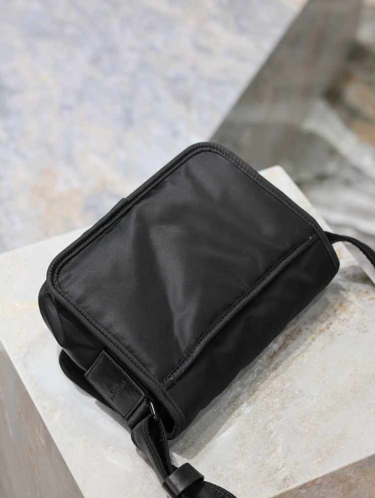 The YSL Saint Laurent Niki small nylon messenger bag is one of the brand's iconic "dark style" favorites.