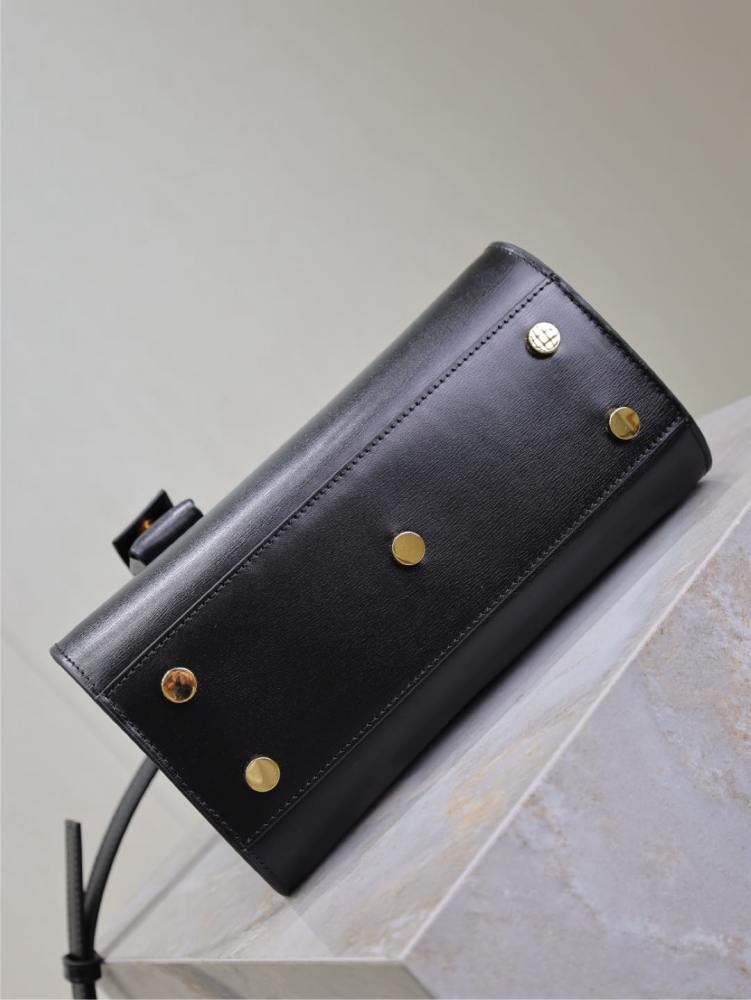 The YSL Saint Laurent Baby Sac De Jour mini bag, also known as the "accordion bag," is the brand's iconic entry-level commuter style.