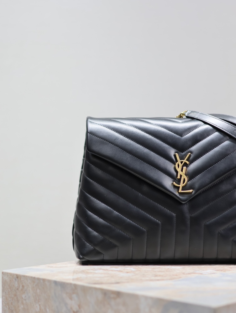 The YSL Saint Laurent LouLou large quilted tote bag, also known as the "envelope tote," is a signature and popular commuter style from the brand.