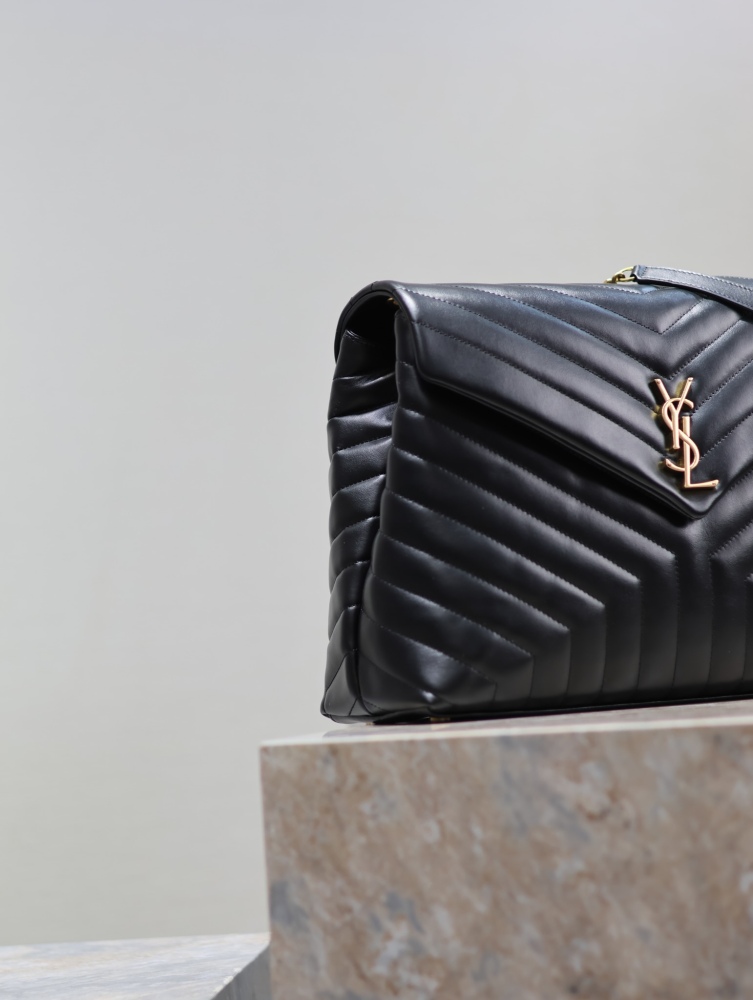 The YSL Saint Laurent LouLou large quilted tote bag, also known as the "envelope tote," is a signature and popular commuter style from the brand.