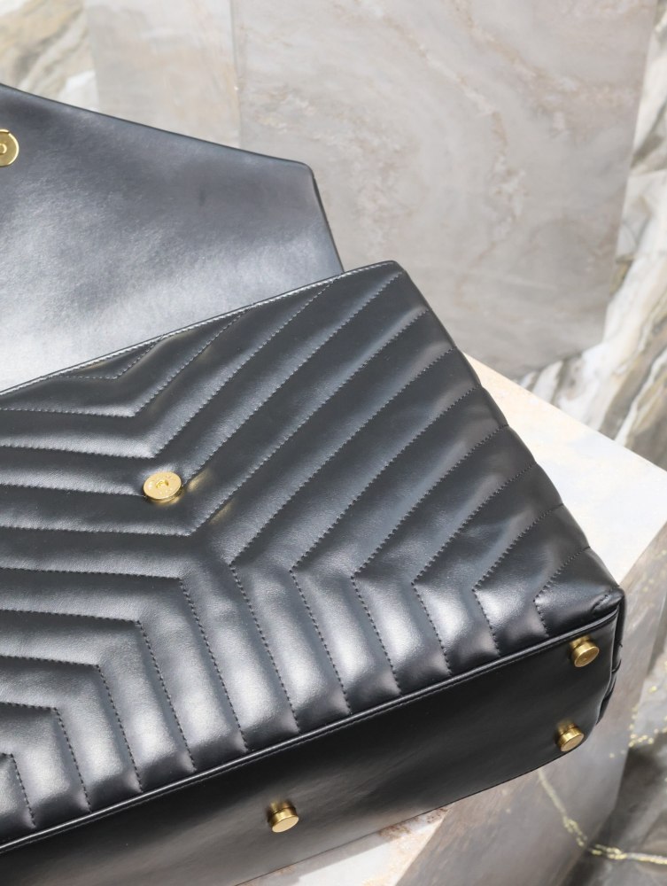 The YSL Saint Laurent LouLou large quilted tote bag, also known as the "envelope tote," is a signature and popular commuter style from the brand.