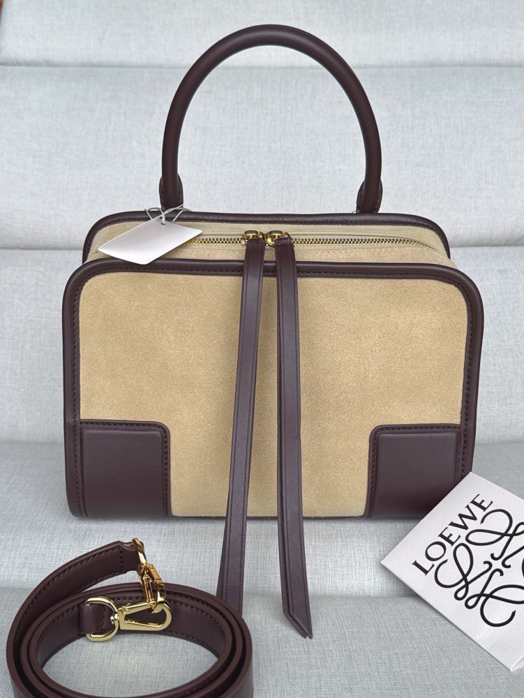 The LOEWE Small Suede Amazona 180 Handbag (Sand / Chocolate Brown) is a new release paying homage to the brand's iconic Amazona series, and has emerged as one of LOEWE's most popular commuter bags in recent years.