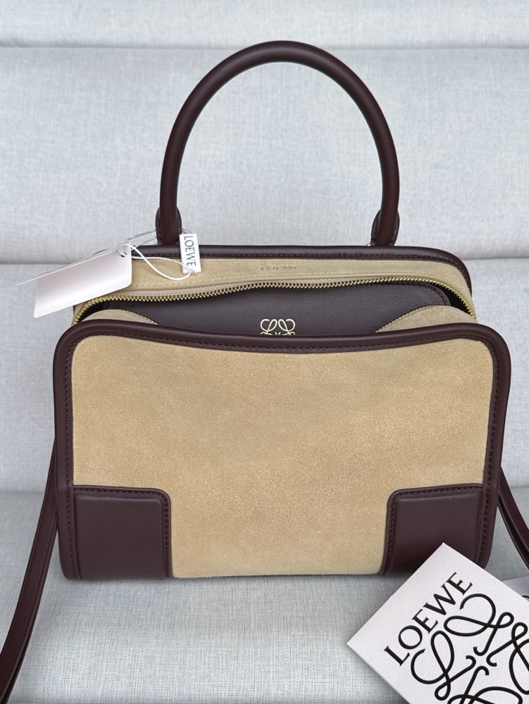 The LOEWE Small Suede Amazona 180 Handbag (Sand / Chocolate Brown) is a new release paying homage to the brand's iconic Amazona series, and has emerged as one of LOEWE's most popular commuter bags in recent years.