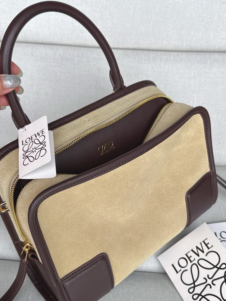 The LOEWE Small Suede Amazona 180 Handbag (Sand / Chocolate Brown) is a new release paying homage to the brand's iconic Amazona series, and has emerged as one of LOEWE's most popular commuter bags in recent years.