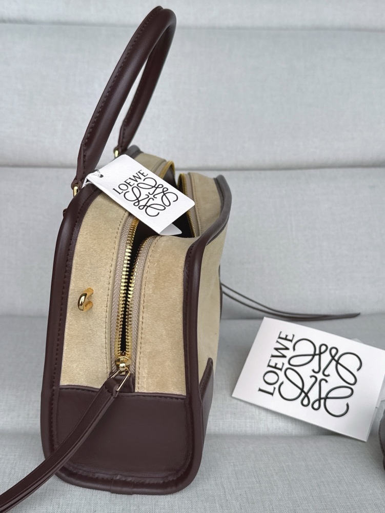 The LOEWE Small Suede Amazona 180 Handbag (Sand / Chocolate Brown) is a new release paying homage to the brand's iconic Amazona series, and has emerged as one of LOEWE's most popular commuter bags in recent years.