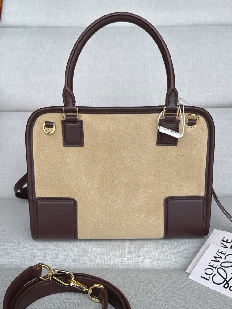 The LOEWE Small Suede Amazona 180 Handbag (Sand / Chocolate Brown) is a new release paying homage to the brand's iconic Amazona series, and has emerged as one of LOEWE's most popular commuter bags in recent years.