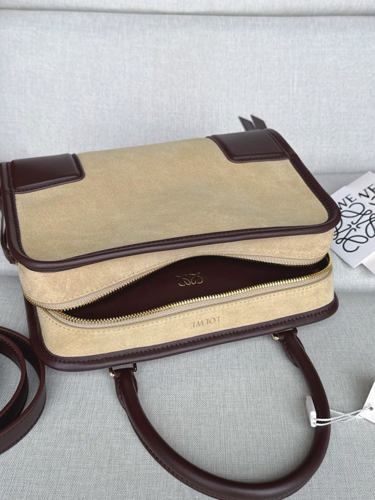 The LOEWE Small Suede Amazona 180 Handbag (Sand / Chocolate Brown) is a new release paying homage to the brand's iconic Amazona series, and has emerged as one of LOEWE's most popular commuter bags in recent years.