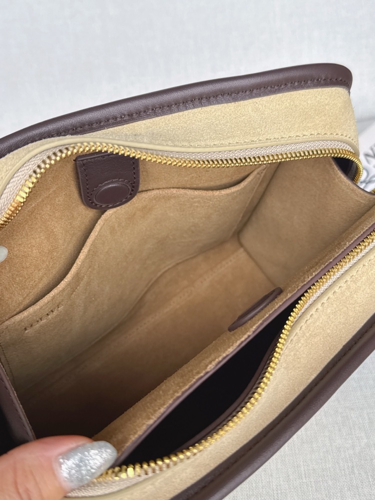 The LOEWE Small Suede Amazona 180 Handbag (Sand / Chocolate Brown) is a new release paying homage to the brand's iconic Amazona series, and has emerged as one of LOEWE's most popular commuter bags in recent years.