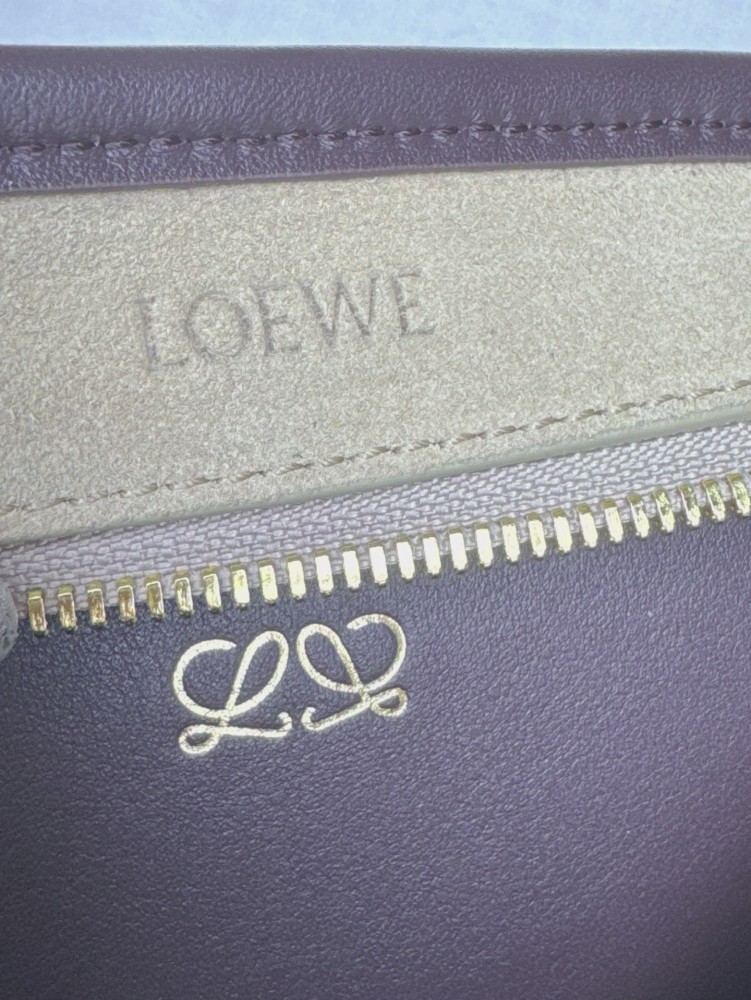 The LOEWE Small Suede Amazona 180 Handbag (Sand / Chocolate Brown) is a new release paying homage to the brand's iconic Amazona series, and has emerged as one of LOEWE's most popular commuter bags in recent years.