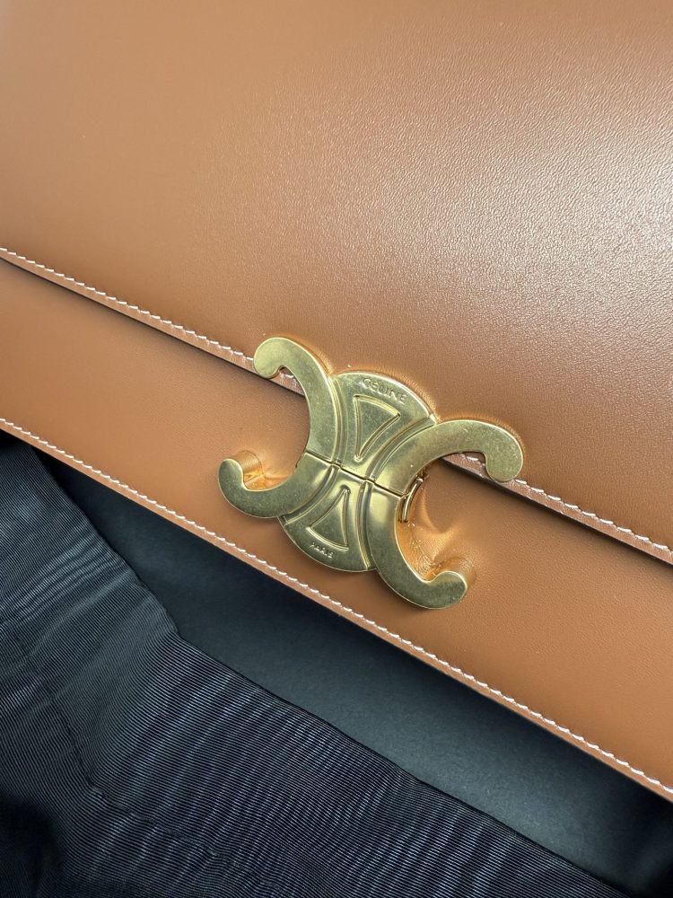 The TEEN-sized handbag from the CELINE Triomphe series (commonly known as the "baguette bag") has been a very popular commuter style for the brand in recent years.