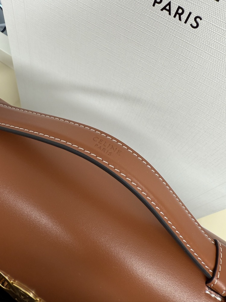 The TEEN-sized handbag from the CELINE Triomphe series (commonly known as the "baguette bag") has been a very popular commuter style for the brand in recent years.