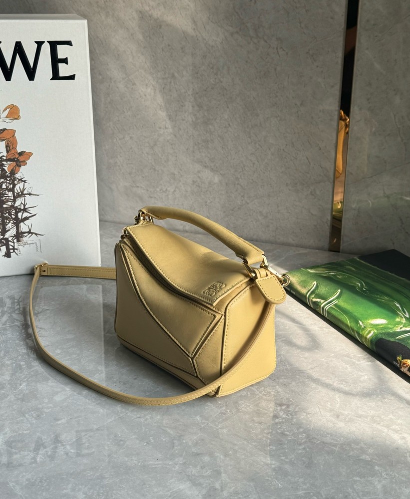 The LOEWE Puzzle Mini geometric bag—often referred to as the "Puzzle Bag"—is one of LOEWE's most classic and iconic styles.