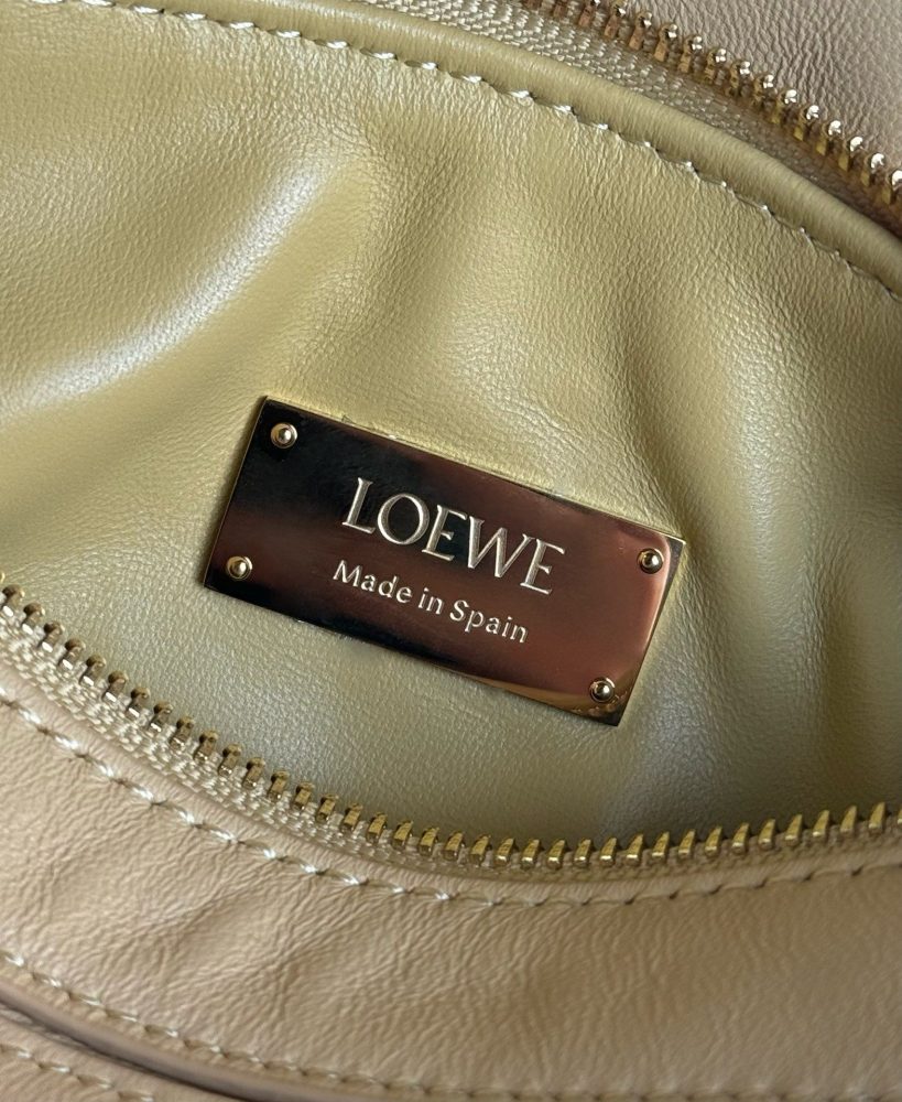 The LOEWE Puzzle Mini geometric bag—often referred to as the "Puzzle Bag"—is one of LOEWE's most classic and iconic styles.