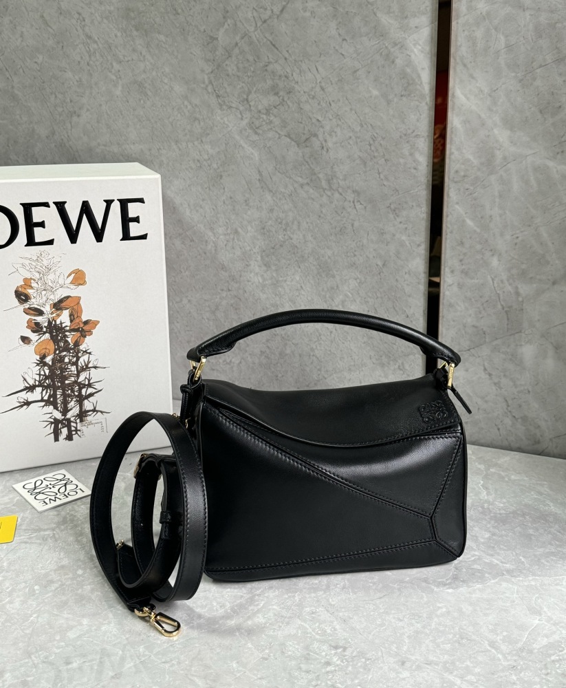 The LOEWE Puzzle Small geometric patchwork handbag—often referred to as the "Puzzle Bag" series—is one of the brand's iconic classics.