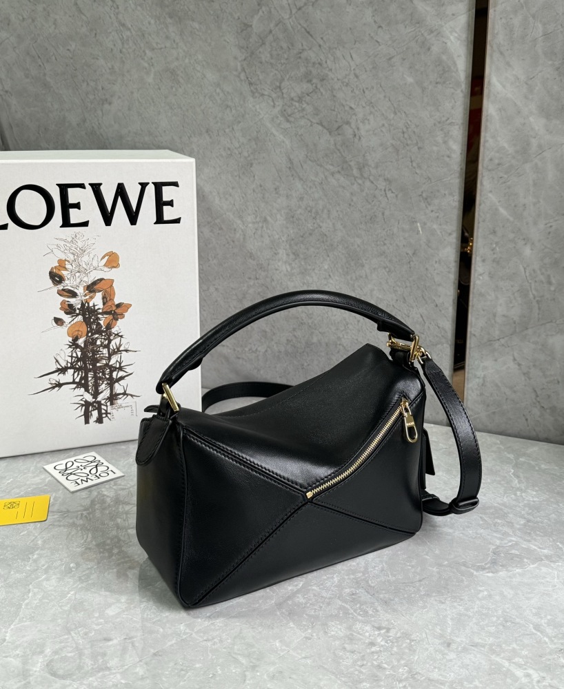 The LOEWE Puzzle Small geometric patchwork handbag—often referred to as the "Puzzle Bag" series—is one of the brand's iconic classics.