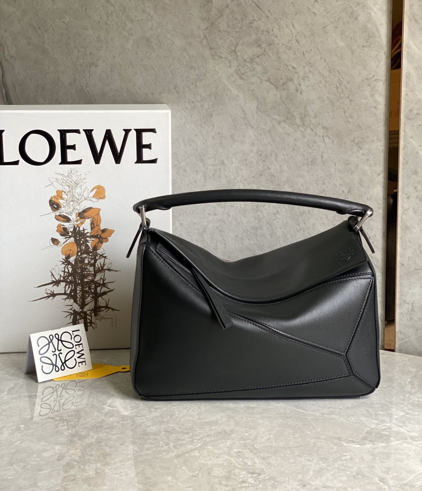 The LOEWE Puzzle Small geometric patchwork handbag—often referred to as the "Puzzle Bag" series—is one of the brand's iconic classics.