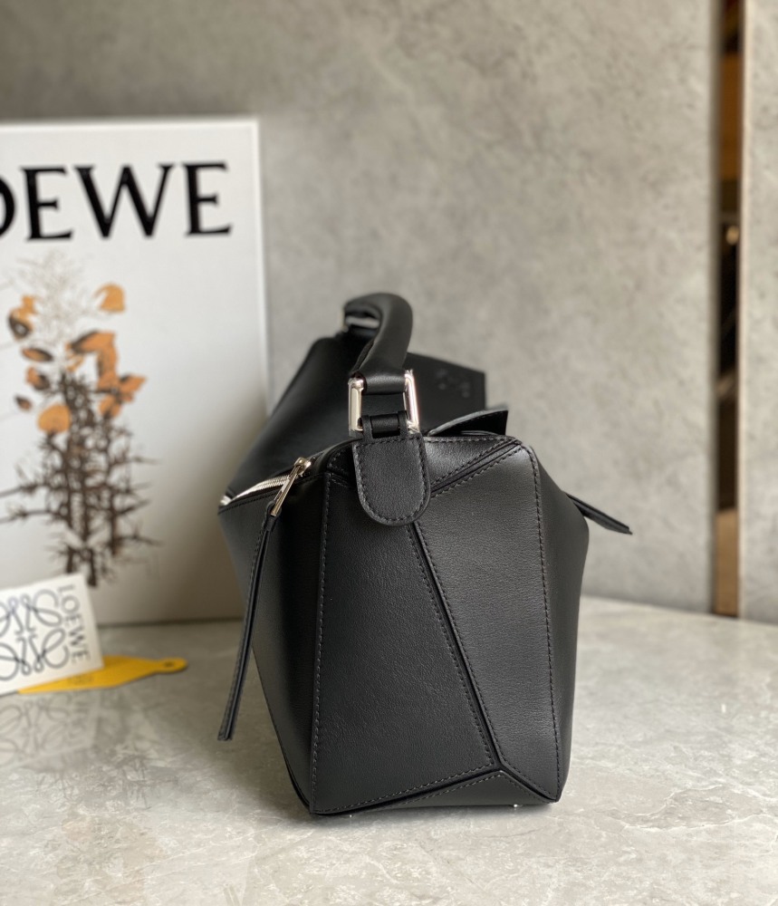 The LOEWE Puzzle Small geometric patchwork handbag—often referred to as the "Puzzle Bag" series—is one of the brand's iconic classics.