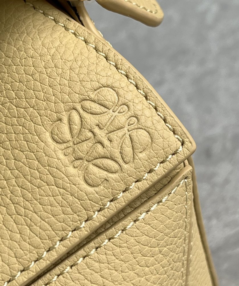 The LOEWE Puzzle Mini bag in soft grained calfskin—the miniature version of the "Puzzle Bag" series, as it is commonly known.