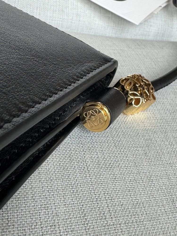 The LOEWE Joya clutch—crafted from Nappa calfskin and also wearable as a small crossbody bag—is a practical piece that embodies the brand's minimalist aesthetic.