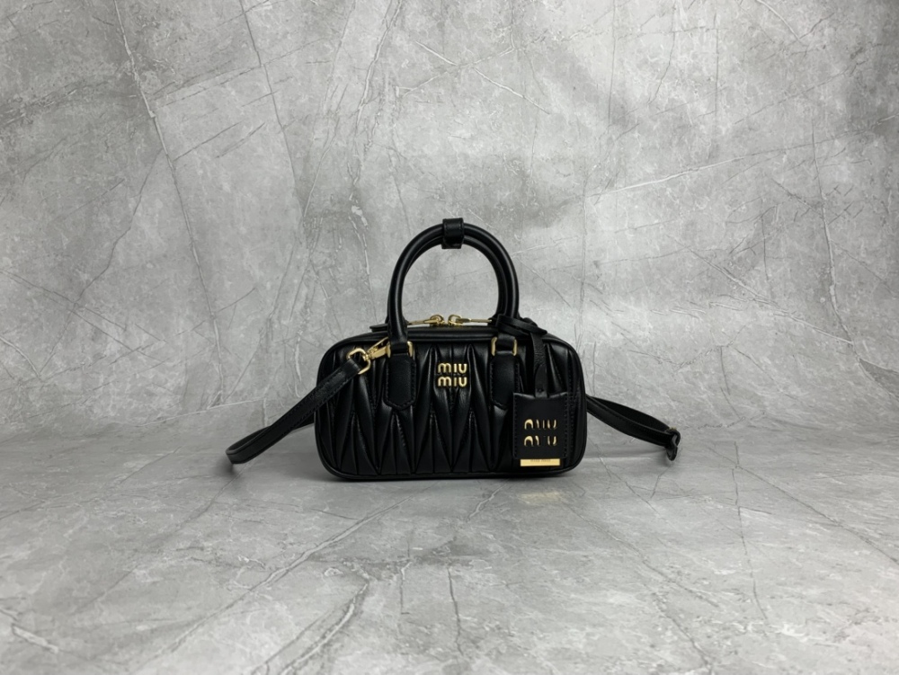 The Miu Miu Matelassé mini bowling bag (black) is a highly popular and trending item from the brand in recent years.