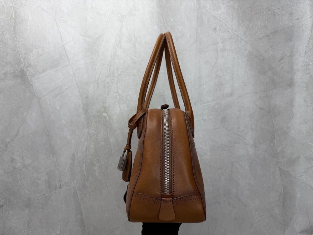 The Miu Miu vintage bowling tote bag is a popular vintage-style work bag in recent years.
