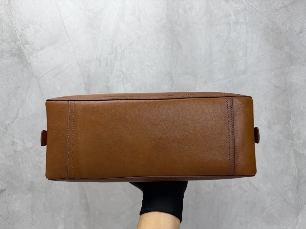 The Miu Miu vintage bowling tote bag is a popular vintage-style work bag in recent years.