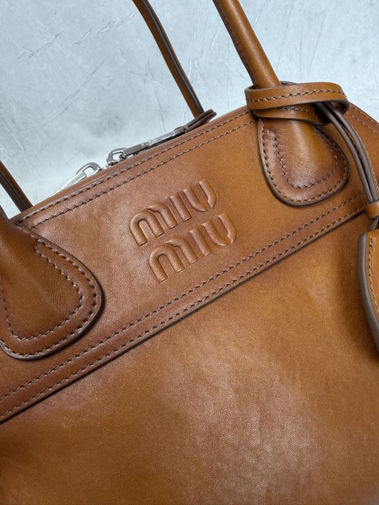 The Miu Miu vintage bowling tote bag is a popular vintage-style work bag in recent years.
