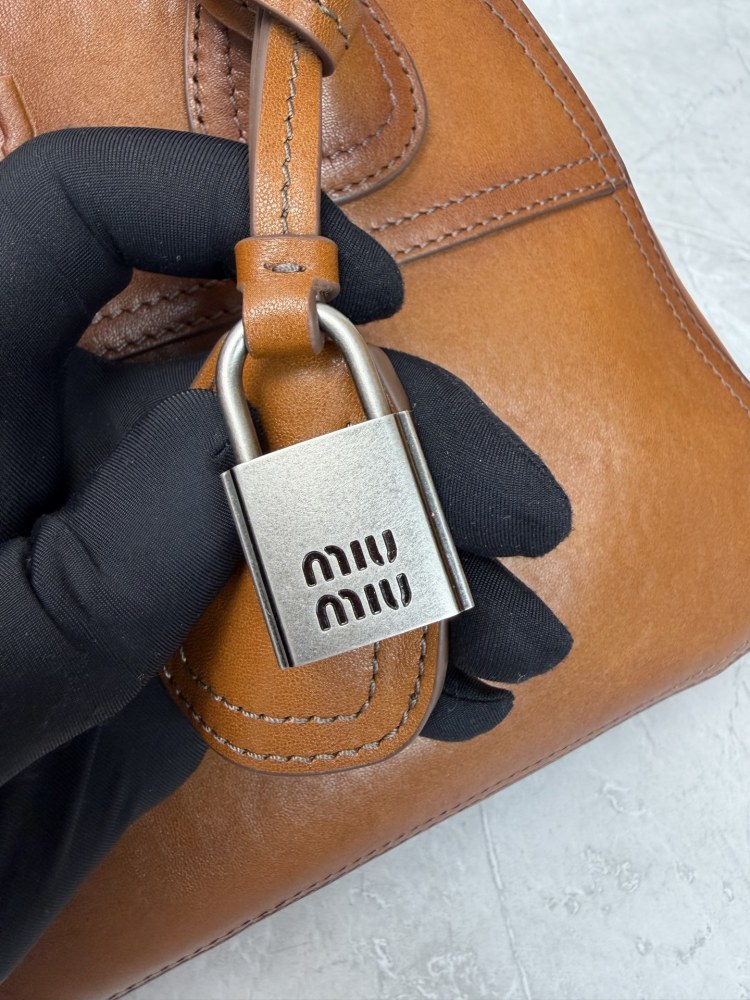 The Miu Miu vintage bowling tote bag is a popular vintage-style work bag in recent years.