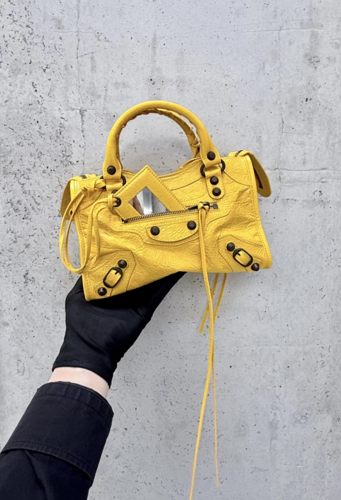 The Balenciaga Classic City Mini Motorcycle Bag is a mini version of the brand's classic motorcycle bag.