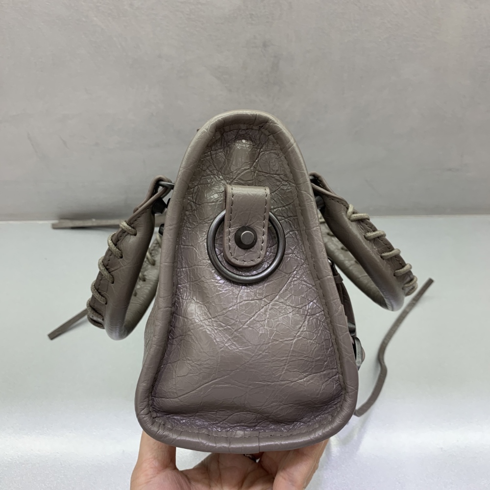 The Balenciaga Classic City Mini Motorbike Bag (Elephant Grey) is a mini version of the brand's classic motorcycle bag.
