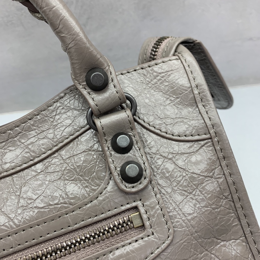The Balenciaga Classic City Mini Motorbike Bag (Elephant Grey) is a mini version of the brand's classic motorcycle bag.